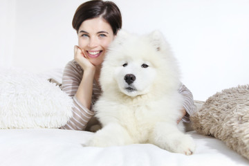 Smiling woman with pet dog