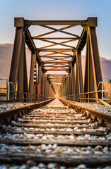 Old metal rail road bridge. With symmetrical metal structure and