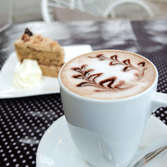 Coffee and cake on polka dot table