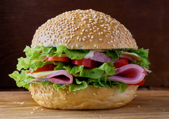 Burger with ham and vegetables