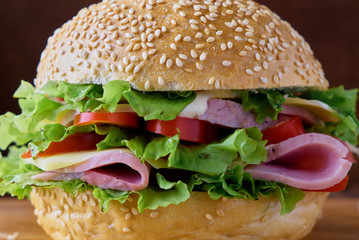 Burger with ham and vegetables