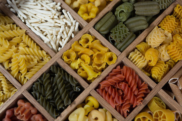 Variety of types, colors and shapes of Italian pasta. Dry pasta