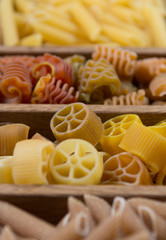 Obraz na płótnie Canvas Variety of types, colors and shapes of Italian pasta. Dry pasta