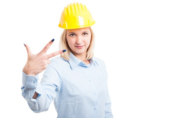 Female architect showing number three gesture