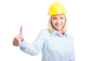 Female engineer showing like gesture and smiling
