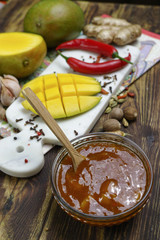 Bowl of homemade Mango Chutney on old wooden table