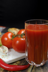 Raw Organic red Tomato Juice with salt, basil and bread