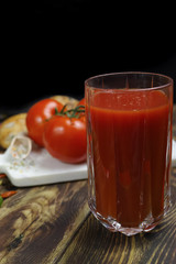 Raw Organic red Tomato Juice with salt, basil and bread
