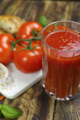 Raw Organic red Tomato Juice with salt, basil and bread
