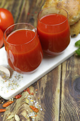 Raw Organic red Tomato Juice with salt, basil and bread