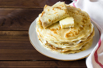 fresh homemade stack of crepes with butter