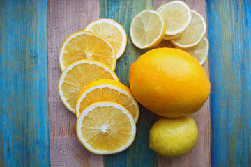 Fototapeta na wymiar slices of lemon and orange on a wooden table