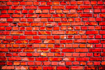 Vintage red brick wall with cracked parts and white spots as background