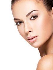 Obraz premium Beautiful face of young woman with health fresh skin