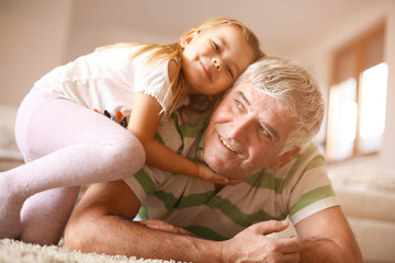 Obraz na płótnie Canvas Grandpa with his granddaughter.
