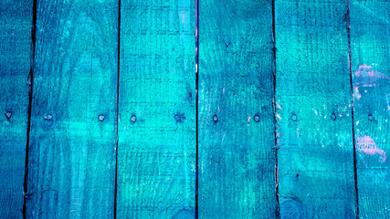 texture of old wooden planks with cracked and smeared paint