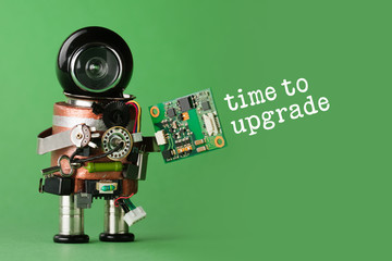 Time to upgrade concept. Robot with abstract circuit chip. retro style toy character with funny black helmet head. green background