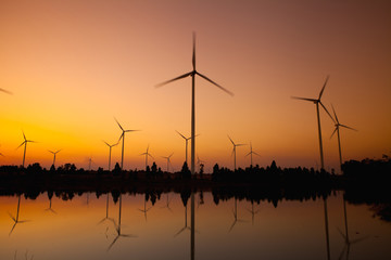 Obraz premium Wind turbine power generator at twilight