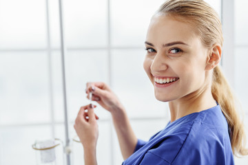 Outgoing physician doing drip bulb