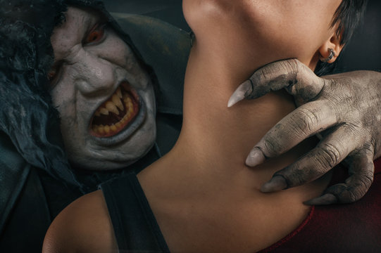 Scary vampire devil biting young woman. Medieval gothic nightmar