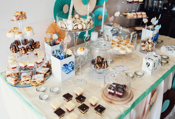The buffet table with cakes