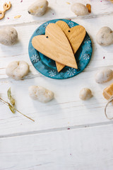 Two wooden hearts on blue plate - Valentine's day concept