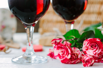 Flowers and glasses of wine on celebration of Valentine's day