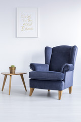 Blue armchair and side table