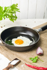Morning in the kitchen. Cooking breakfast. Fried egg.