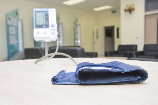 blood pressure monitor check up health and culf on desk