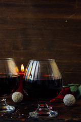 Romantic dinner drink - wine or brendy in glass.