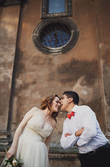 The couple in love stands   near building