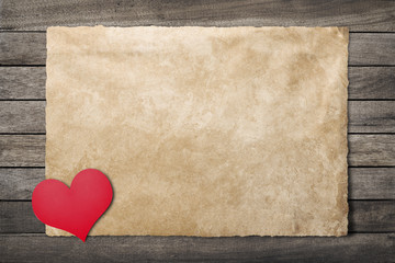 Paper heart on an old paper