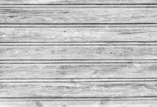 Old white wooden planks texture with weathered paint