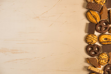 Different cookies with chocolate / background