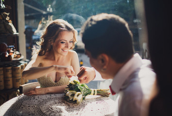 The lovely couple in love sits in restaurant