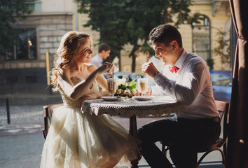 The lovely couple in love sits in restaurant