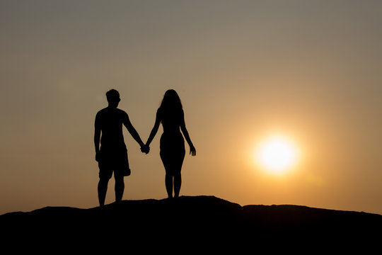 Silhouettes of a young couple.