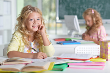 Fototapeta premium beautiful little girls at class