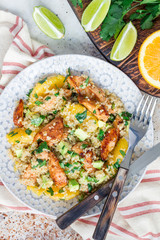 Quinoa, orange and chicken salad tabbouleh, vertical, top view