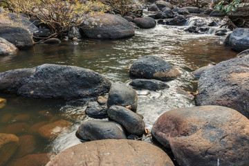 Naklejka na ściany i meble Stone River in Waterfall in national park
