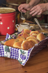 Pies with cranberries in basket on table