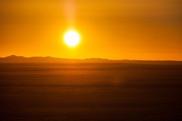 Fototapeta na wymiar End of a Safari-day, Sunset above desert in Africa.