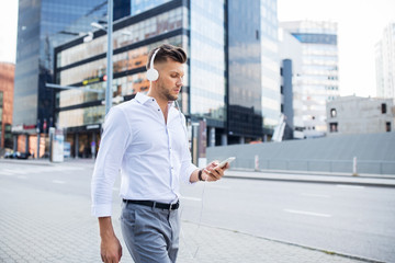 Fototapeta premium man with headphones and smartphone listening music