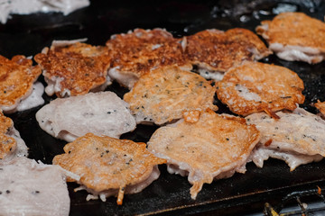 Fried coconut pancake or Baa Bin on hot stove at thailand.