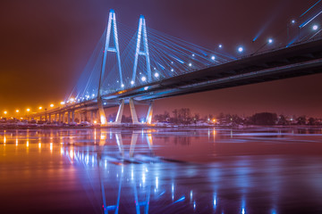 Fototapeta na wymiar Night Bridge with lights. Cable-stayed bridge.