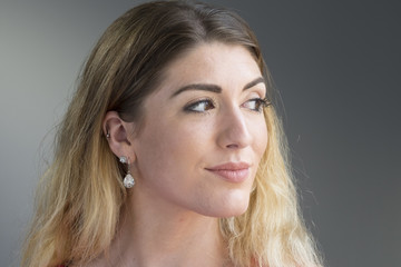 Fototapeta premium Portrait of a young woman looking away from the camera