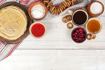 Russian pancake blini on white wooden background