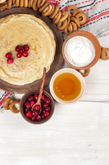 Russian pancake blini on white wooden background