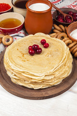 Russian pancake blini on white wooden background